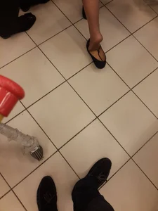 College Candid Teen's Foot in Pantyhose And Flats Dangle