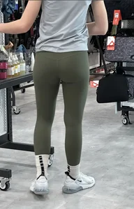Sexy butt and legs in green leggings, candid girl at the store creepshot