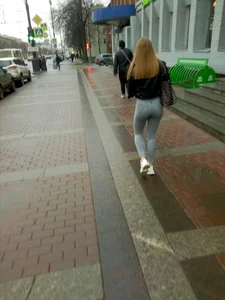 Girl With a Juicy Booty And Legs in Light Blue Tight Jeans Walking Down a Winter Street
