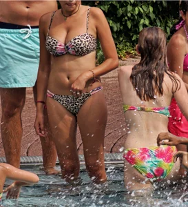 Hot big boobed girl in bikini at the pool