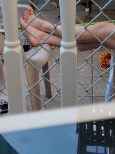 Girl Put Her Legs on the Chair Closeup Feet Candid Pic