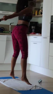 Sexy girlfriend doing yoga at home in leggings