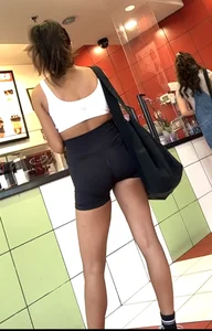 hot petite Indian chick showing some T&A in skimpy workout clothes