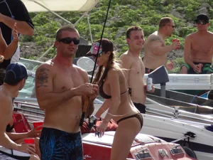 Party girls looking sexy out on boats in bikinis