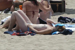 Girls on a nude beach in Sitges, Spain