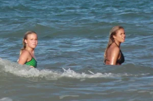 Hot surfer chicks out in the water
