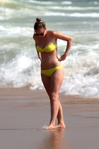 Big booty white girl in a yellow bikini at the beach
