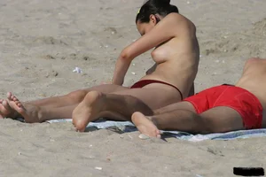 Beach voyeur girls in bikinis, thongs and topless