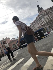 Young Girl in Shorts And Sandals Crossing the Street Gallery