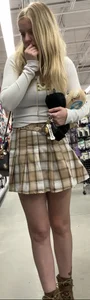 Busty butter face in a skirt and tight top
