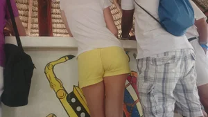 Milf in yellow shorts with vpl and a wedgie