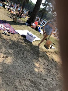 Skinny Girl Undressing on the Lake Beach