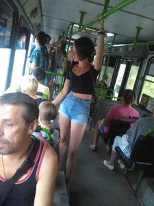 Amazingly Hot Girl in a Top and Denim Shorts Standing in a Public Bus - Sexy Legs
