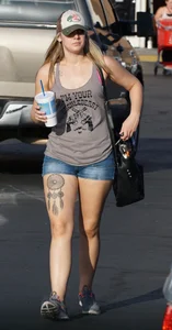 Hot blonde after shopping in short jean shorts and tank top