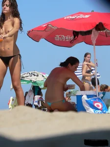 2 topless thonged sexy friends on the beach with great bodies