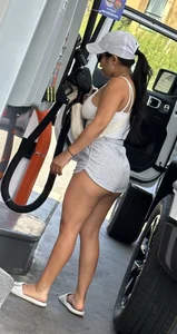 Sexy fit latina with cheeks coming out of booty shorts