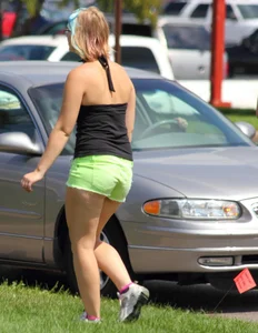Blonde girl in glasses with a thick booty in green shorts