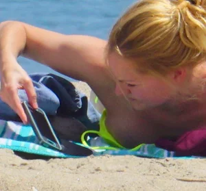 Sexy ass blonde milf on the beach in a thong with cameltoe and bending over