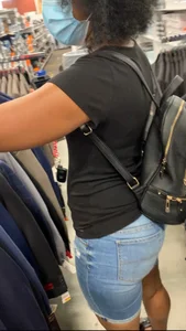 Ebony MILF browsing clothes