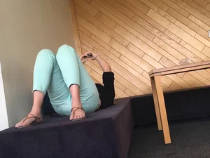 Girl in Sandals Lying in Tight Pants Candid Photo