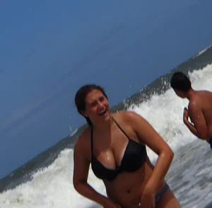 Thick beach girl with massive boobs