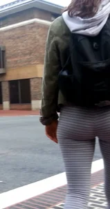 College girl in striped leggings walking with nice ass