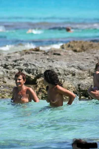 Nude beach ladies in the water showing their tits
