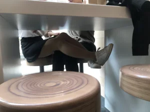 Girl in a Skirt and Pantyhose Touching Herself Under a Table at a Restaurant Creepshots Collection