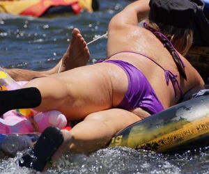 Sexy party girls in bikinis on a lake