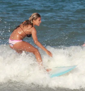 Hot surfer chicks out in the water
