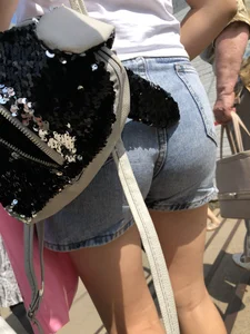 Cute Girl in Denim Shorts Walking Down a Railway Station Gallery
