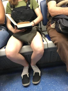 Girl with Hot Spread Legs in White Socks Reading in Subway Train with Her Shoes Half Taken Off Candid Photo