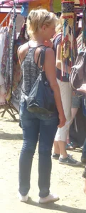 Skinny milf wearing tight blue jeans, creepshot at the street market; nice ass and slim legs