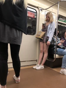 Blonde with Cute Skinny Legs in a Dress Standing in a Subway Train Creepshot