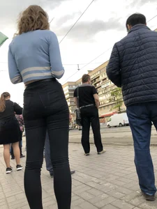 Skinny Girl in Tight Black Jeans on the Bus Stop Candid Photos