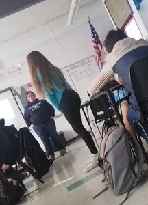 Girl in Leggings in College Classroom Candid Photo