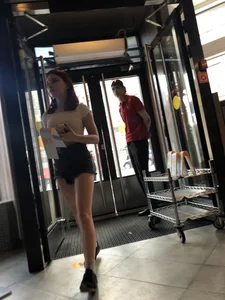 Cute Teen Girl in Mini-Shorts Walking into a Cafe Legs And Booty Closeups