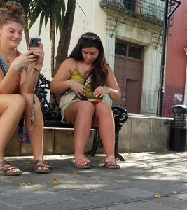 Nice legs and feet in the park (one of them showing little else)