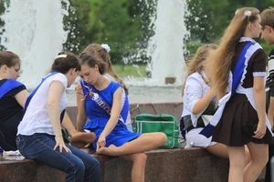 Young College Girls in Dresses, Skirts And Pantyhose Having a Good Time By the City Fountain