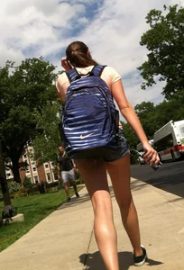 Hot college girl in little jean shorts showing some cheeks and legs