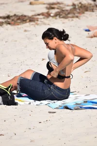 Thick mature brunette bikini lady on the beach with a nice body