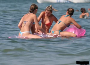 A bunch of sexy beach voyeur babes in bikinis, thongs and topless