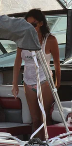 Bikini babe on a boat with a wet see through white shirt showing her tits