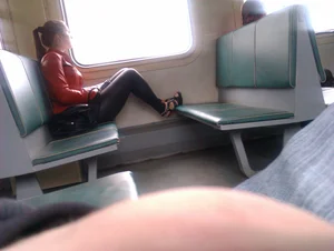 Girl in Leather Leggings and High Heeled Resting Her Legs on an Opposite Seat Public Train Creepshot