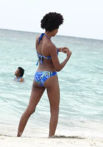 Candid black family, milf and teens on the beach in bikinis