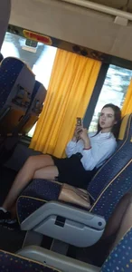 Cute Candid Skinny Teen in a Skirt Sitting in a Bus Photo