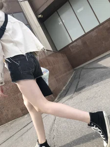 Cute candid teen with pale slim legs in shorts