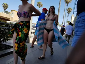 Skinny Girl in Flip-Flops and Swimsuit