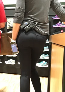 Shoe store employee with a sexy bubble butt in leggings