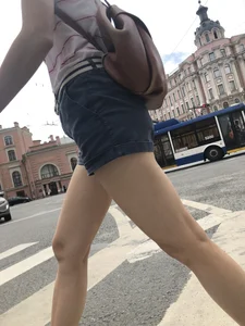 Young Girl in Shorts And Sandals Crossing the Street Gallery